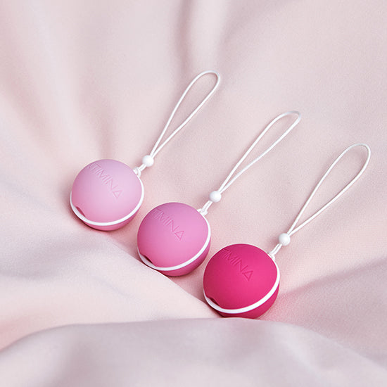3 kegel weights in pink on a pink background. Enjoy a strong pelvic floor . מוצרי המחזור הרב פעמים הכי טובים ונוחים בישראל, תחזקי את רצפת האגן שלך עם אהבה
