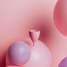 גביעונית מחזור הלו וורודה על רקע וורוד שאלון יעוד הגביעוניות רב פעמי  menstrual cup